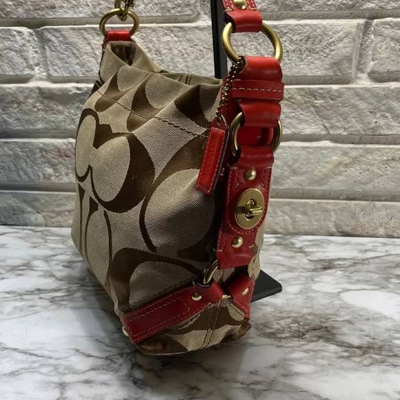 Coach Carly Signature Hobo Bag with red leather trim and gold-tone hardware. - Picture 3 of 14